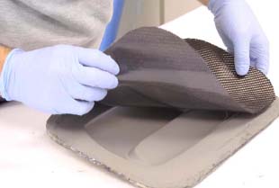 Easy Composites’ Easy-Preg surfacing ply has a special solid resin film on one side only which is laid against the mould surface